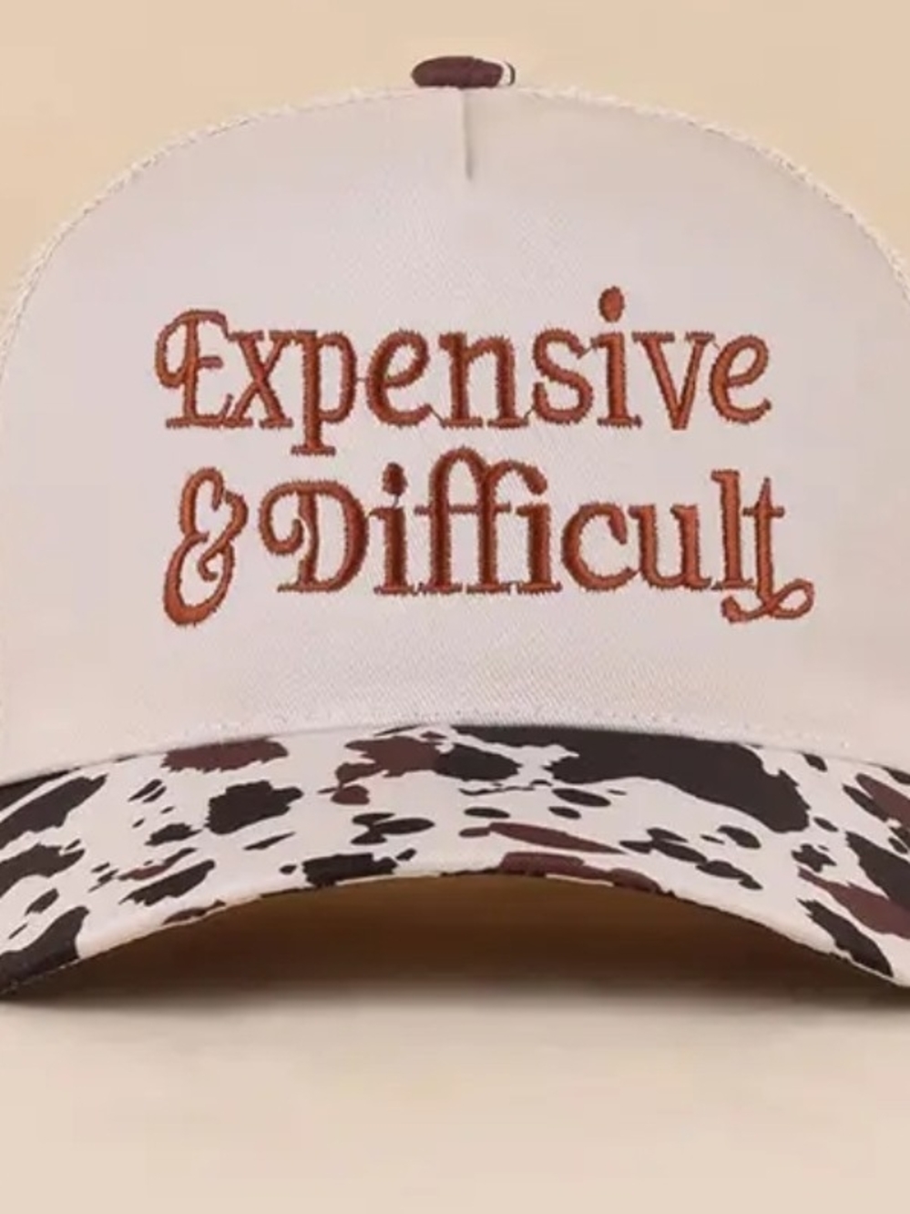 Beige 'Expensive & Difficult' Embroidered Trucker Hat with Cow-Print Visor